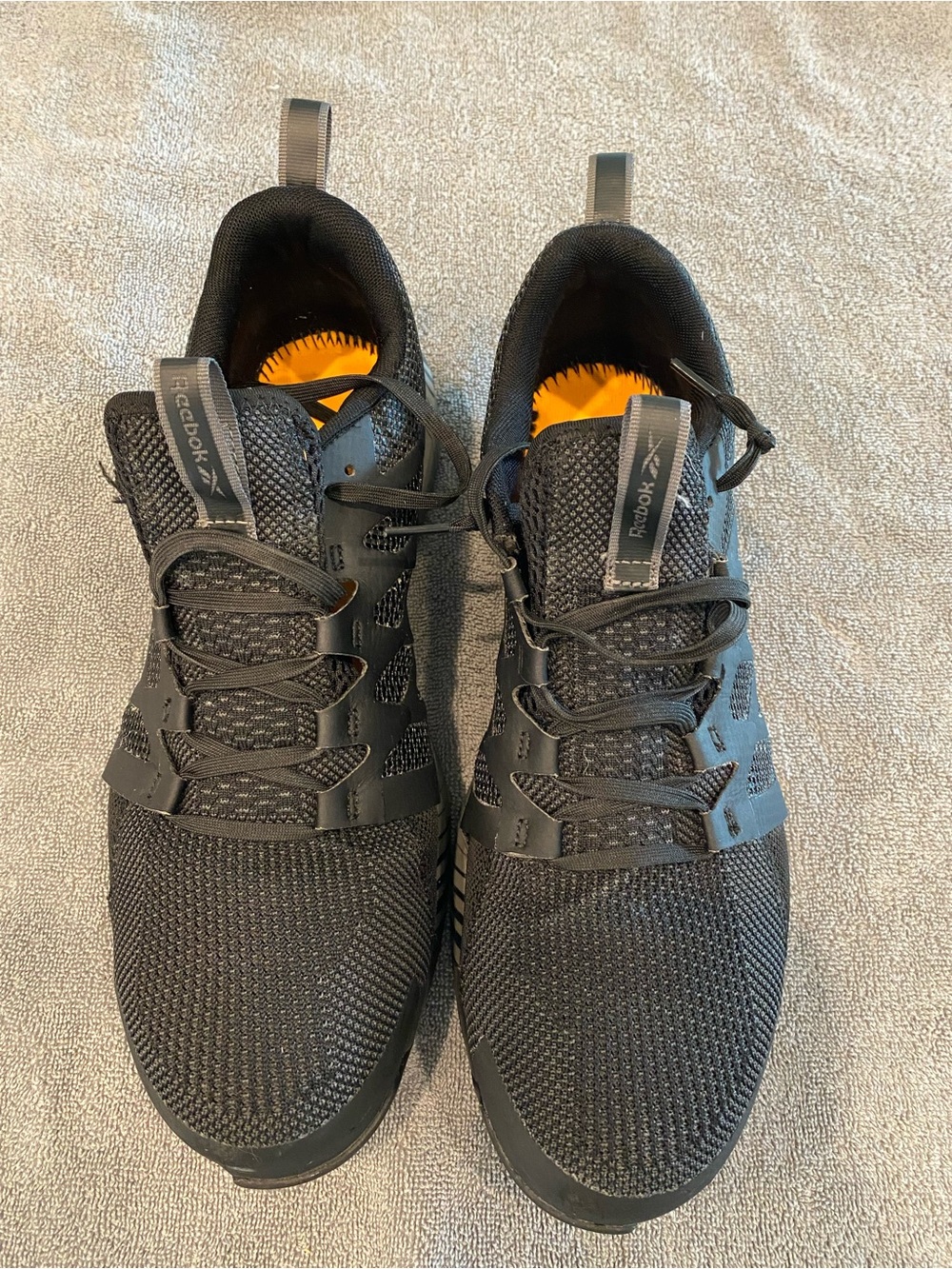 Reebok Men’s Black Athletic Knit Sneakers with Orange Accents